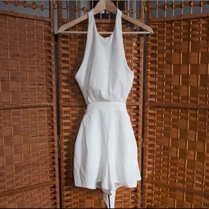 New without tags. Sleek white romper.